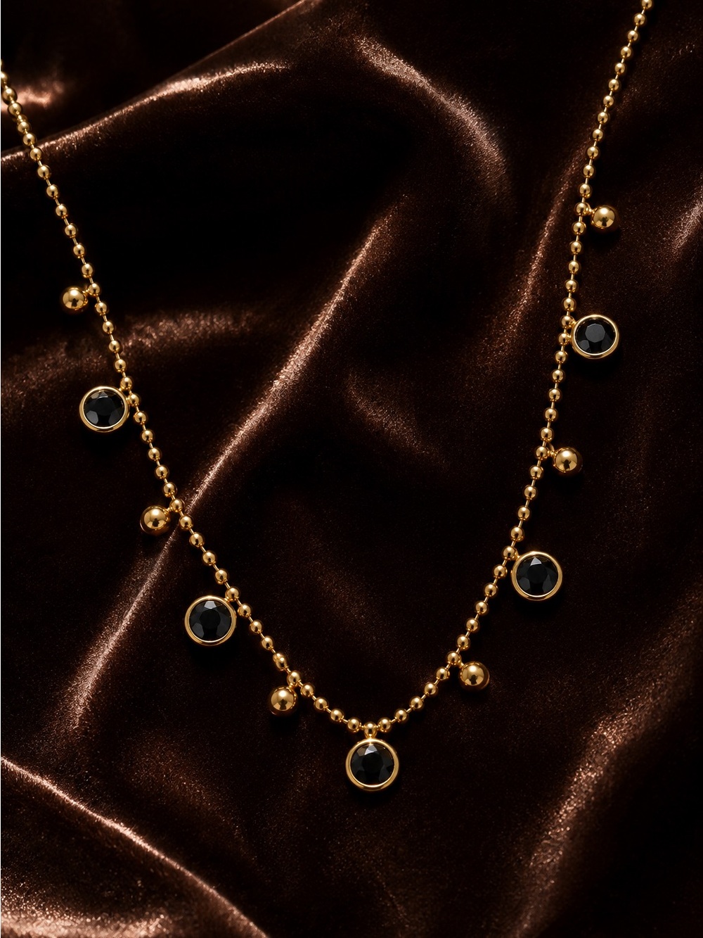 Gold olated Bead Necklace with Black Cabochons